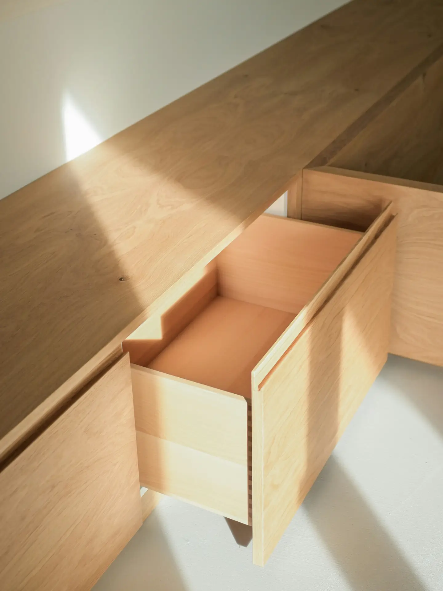 High-quality soft-close cabinet drawers and custom hardware installation.